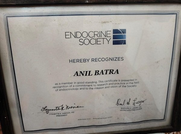 A framed certificate from the Endocrine Society recognizing Dr. Anil Batra for his commitment to research and practice in endocrinology.