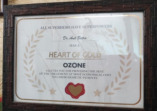 "Framed certificate honoring Dr. Anil Batra with a 'Heart of Gold' award from Ozone for providing economical treatment to cardio-diabetic patients."