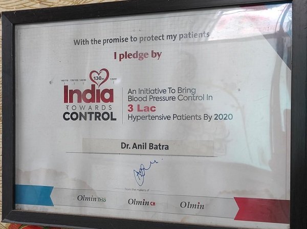 "Framed pledge certificate by Dr. Anil Batra supporting the 'India Towards Control' initiative for hypertension management."